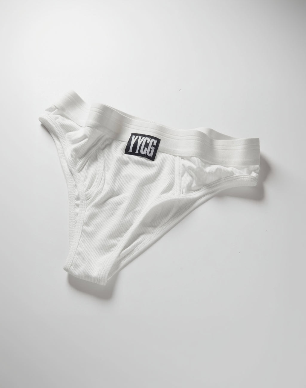 White men's underwear with a logo on a light gray background