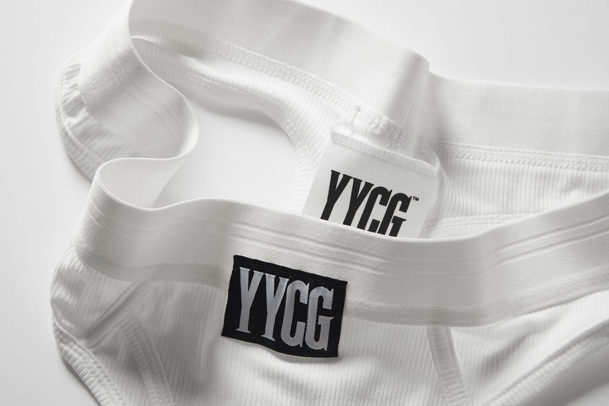 White fabric with 'YYCG' labels on a light gray background