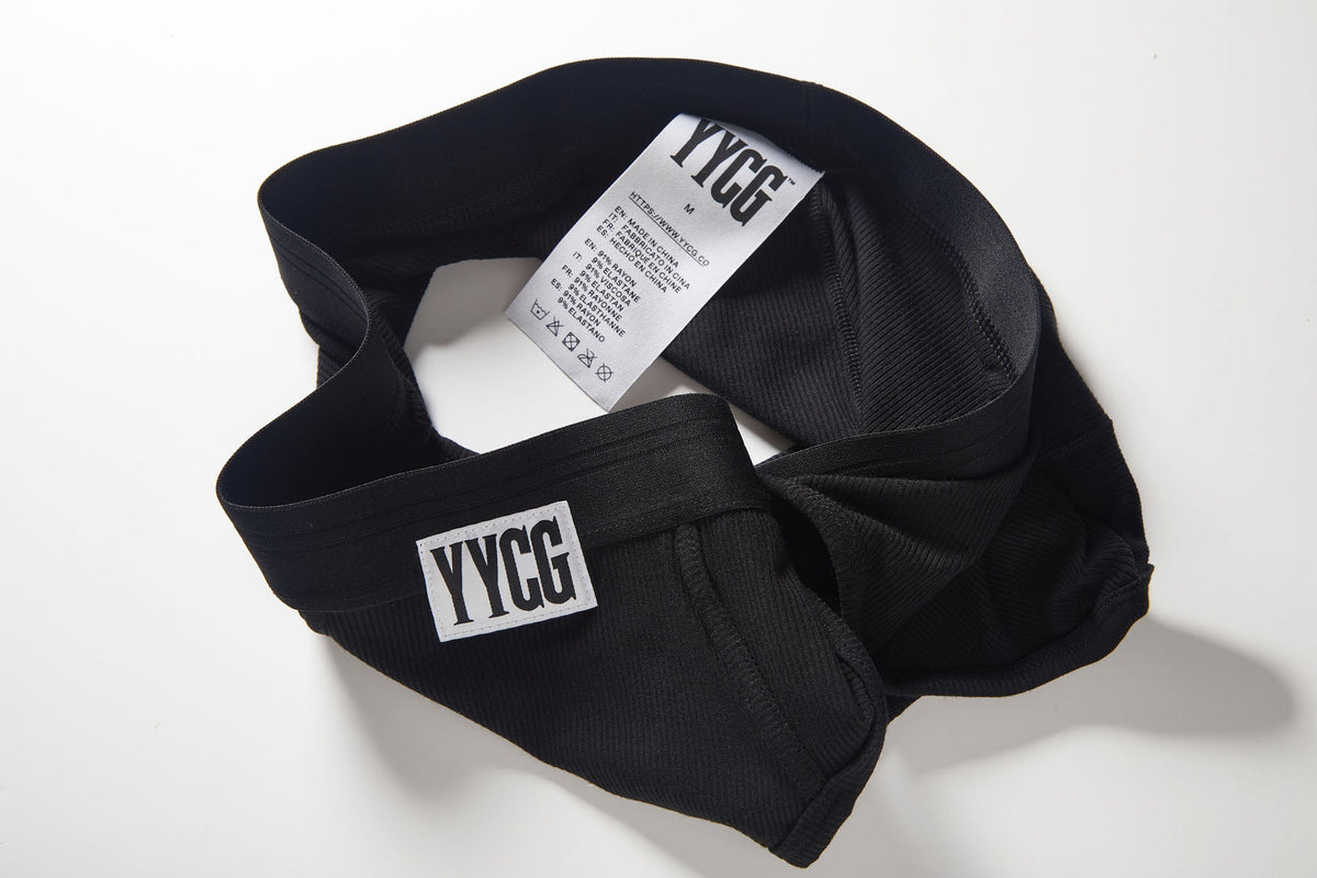 Black headband with 'YYGG' branding on a white background