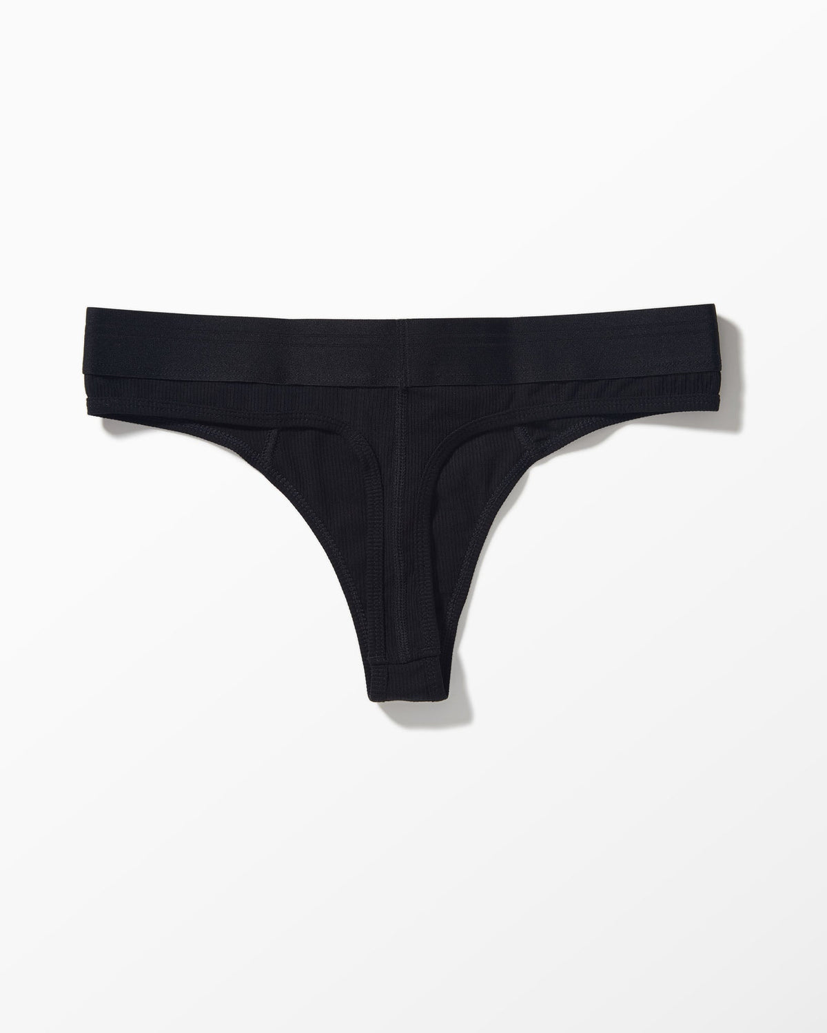 Black thong-style underwear photographed flat against a clean white background.