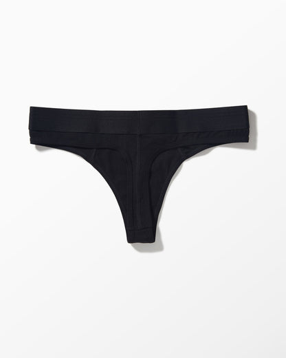 Black thong-style underwear photographed flat against a clean white background.