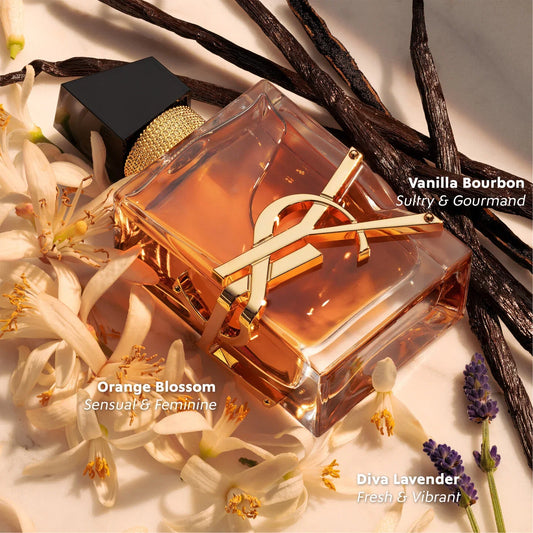 Yves Saint Laurent Libre Intense Eau de Parfum bottle with vanilla beans, orange blossoms and lavender on a light background