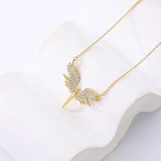 Gold necklace with a detailed pendant on a white background