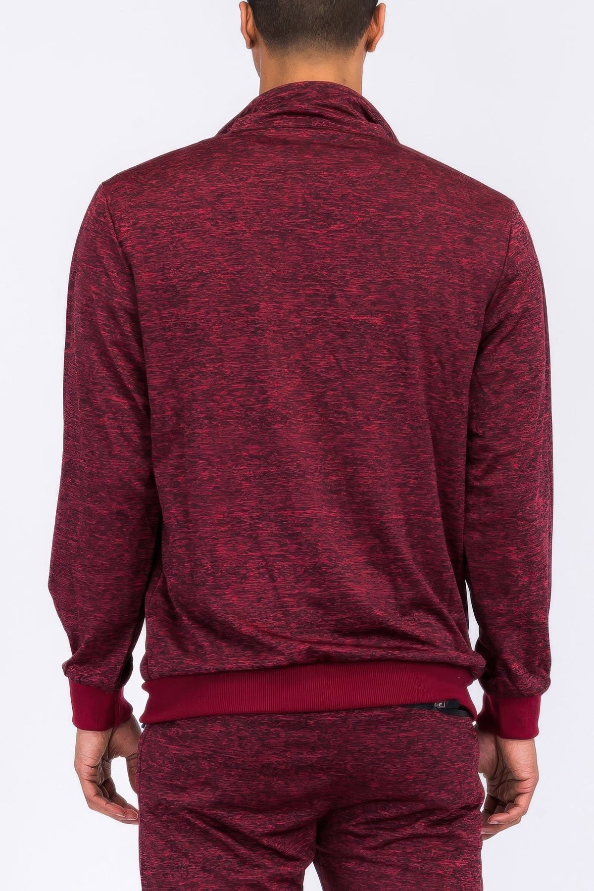 Maroon tracksuit worn by a person on a white background