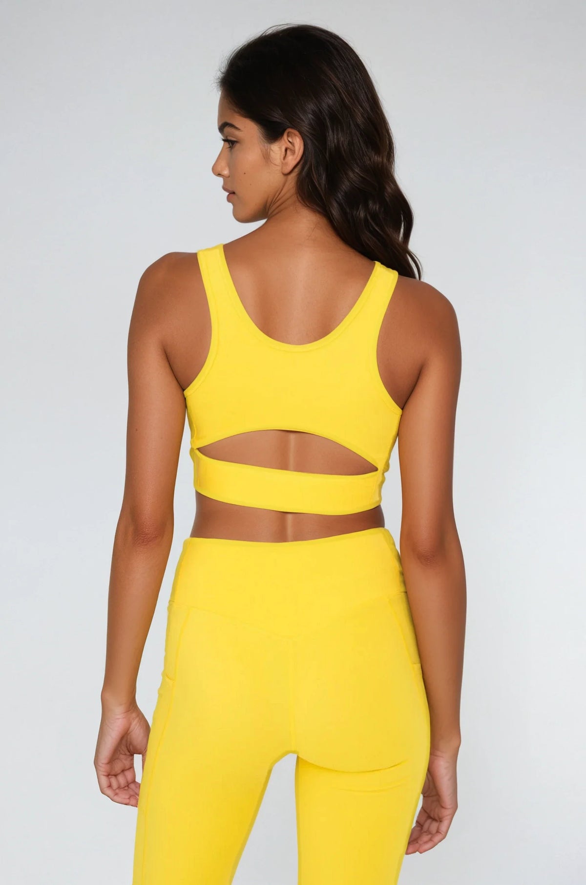 Breathe Easy Cut-Out Back Sports Bra in Yellow, styled photo