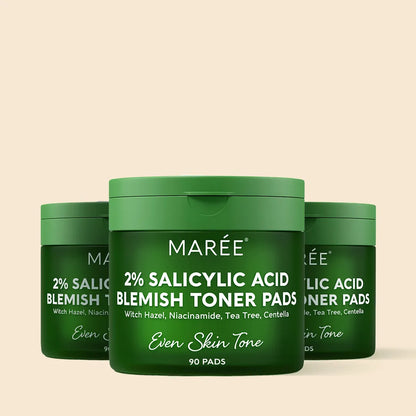 Green containers of Maree 2% Salicylic Acid Blemish Toner Pads on a beige background