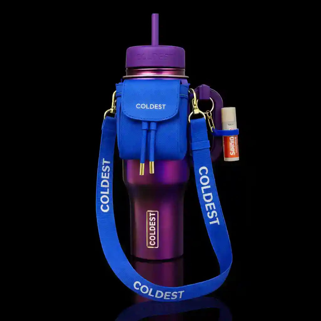 Purple water bottle with blue strap and accessories on a black background