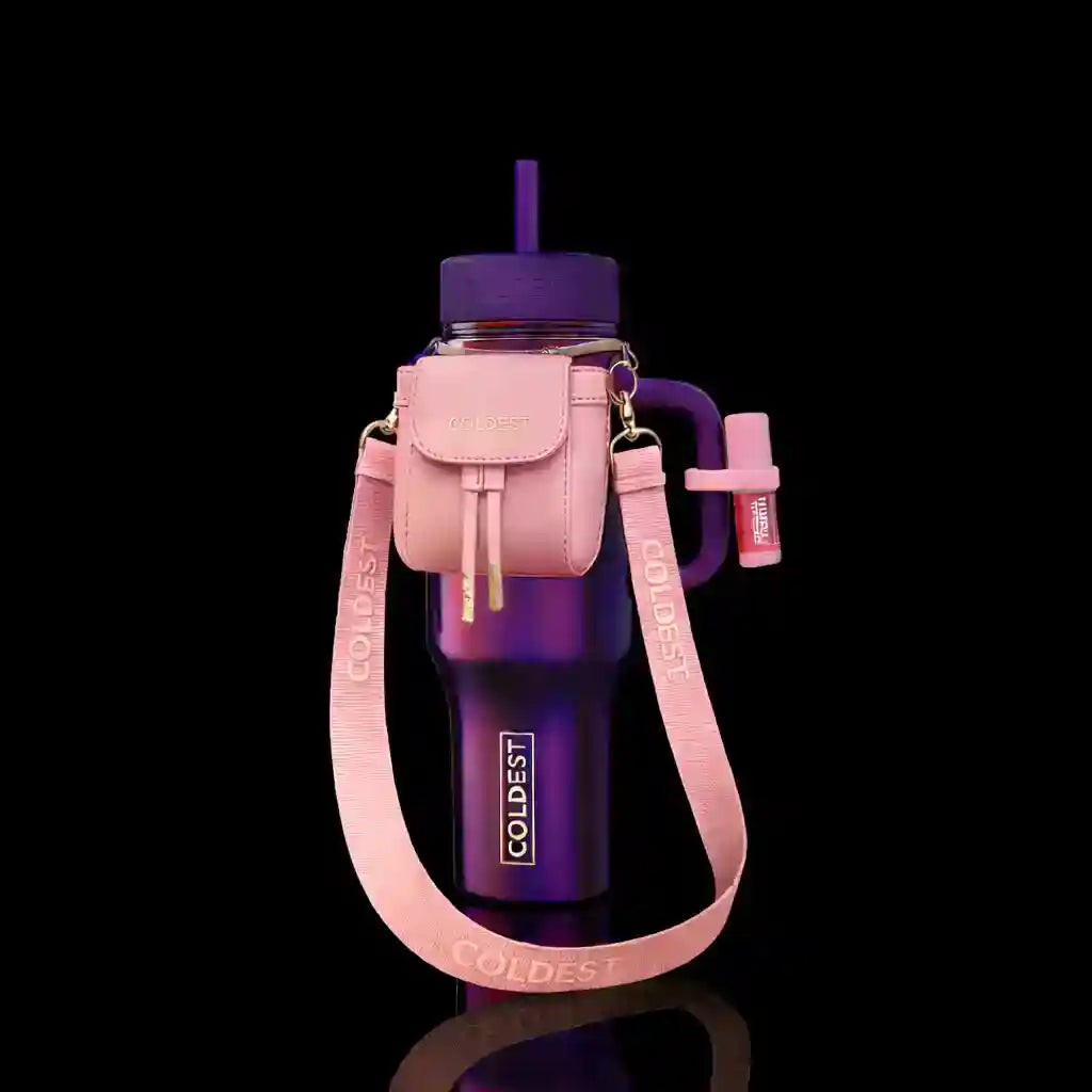 Purple water bottle with pink carrying case and strap on a black background