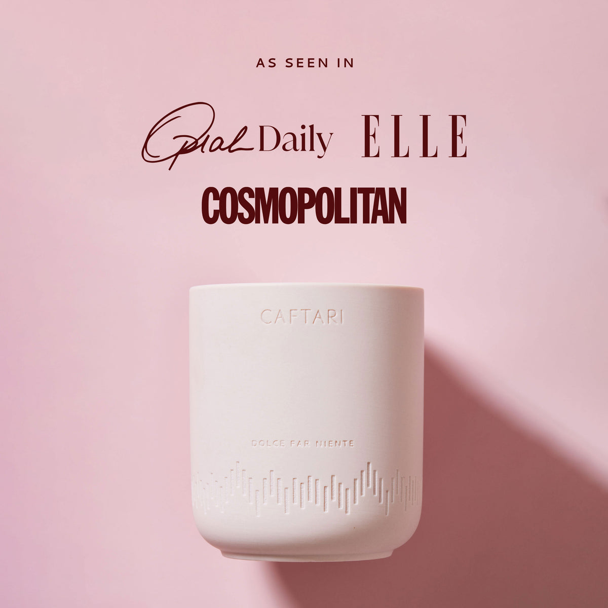 Dolce Far Niente candle on a pink background alongside press mentions