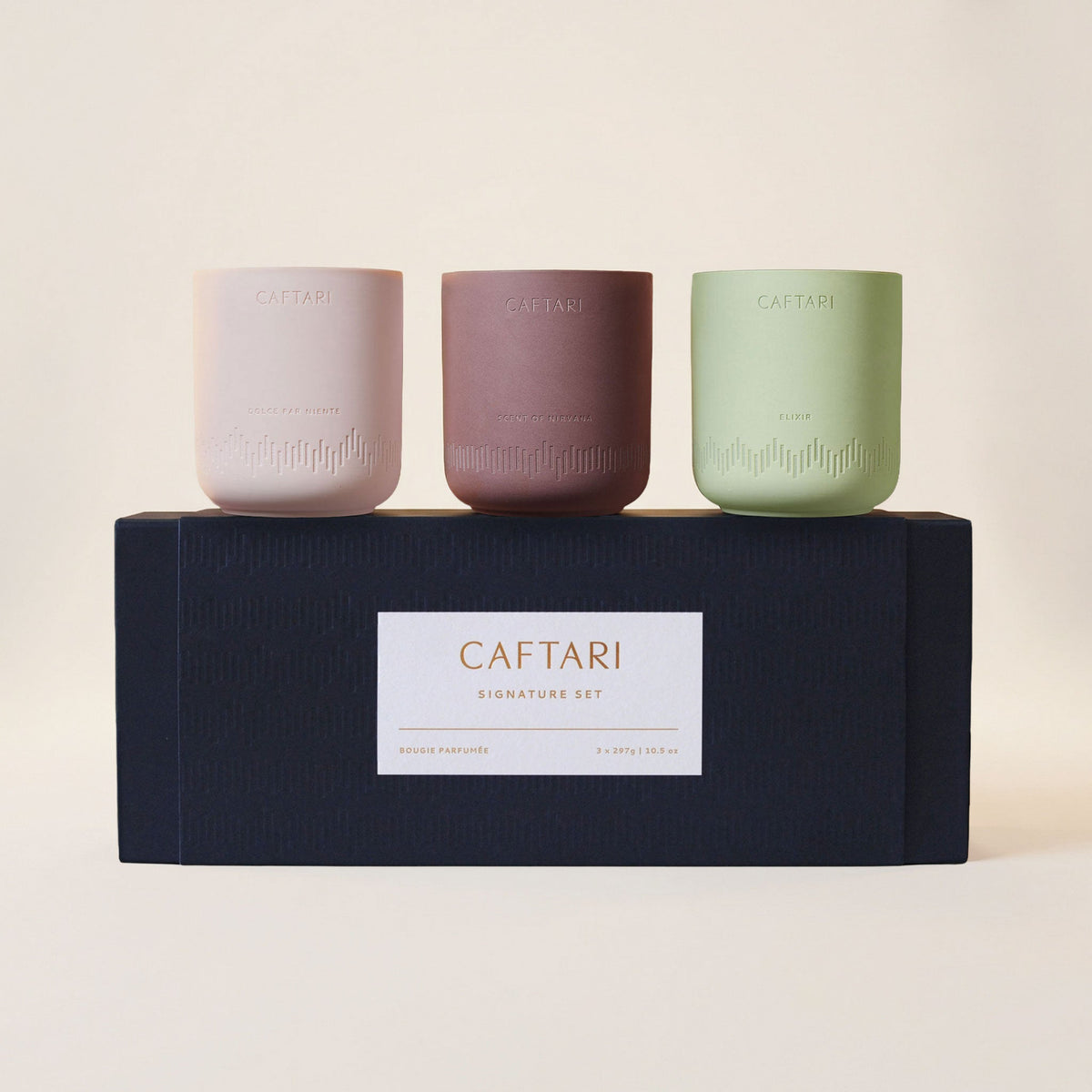 Caftari Signature Candle Gift Set: three ceramic candles beside a black Caftari gift box