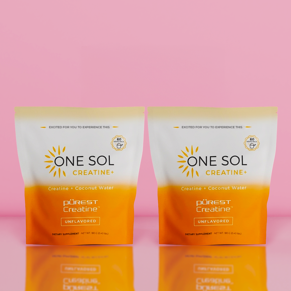 Two packages of One Sol Creatine on a pink background