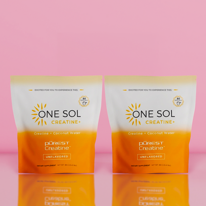 Two packages of One Sol Creatine on a pink background