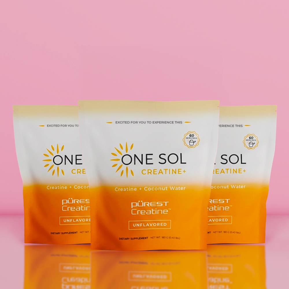 Three packages of ONE SOL Creatine on a pink background