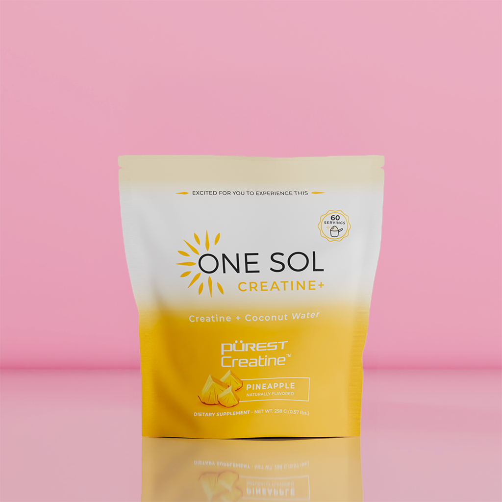 A stand-up pouch of One Sol Creatine+ dietary supplement in Pineapple flavor, featuring a white-to-yellow gradient design with a sun graphic and the Purest Creatine logo, set against a solid pink background.