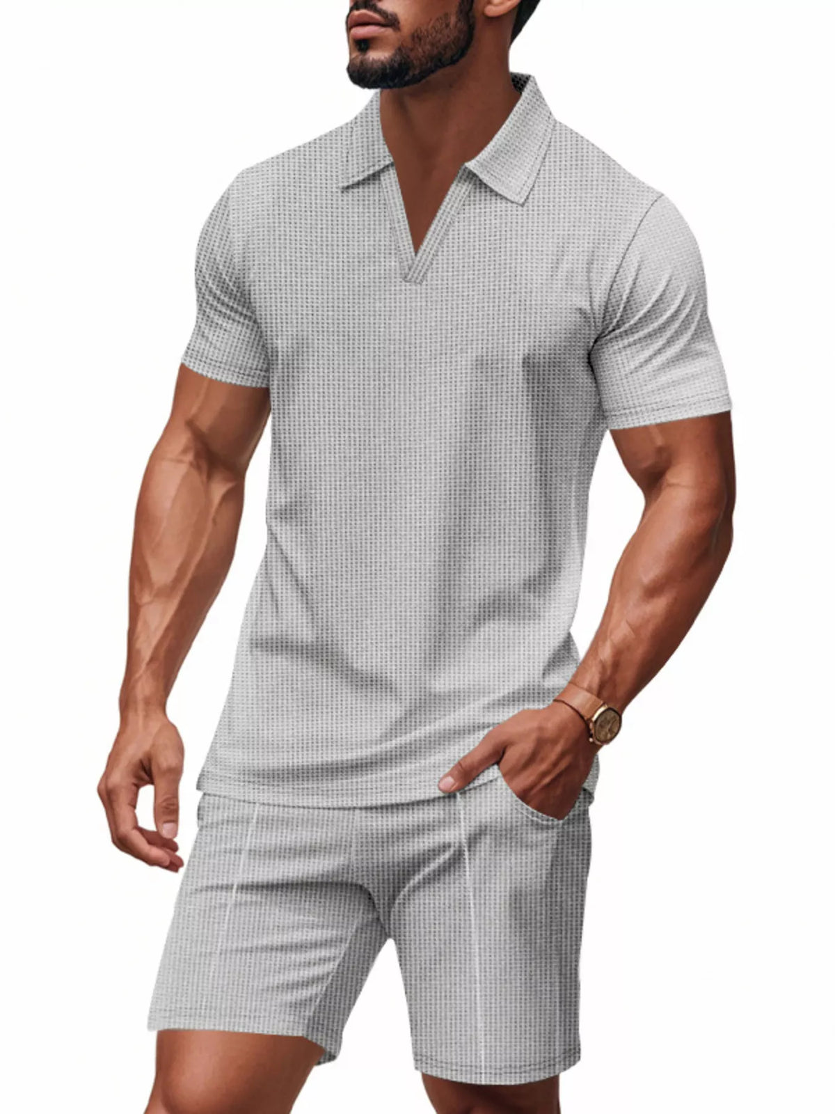 Man wearing a checkered polo shirt and shorts on a white background