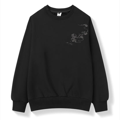 Black sweatshirt with a small design on the chest against a white background