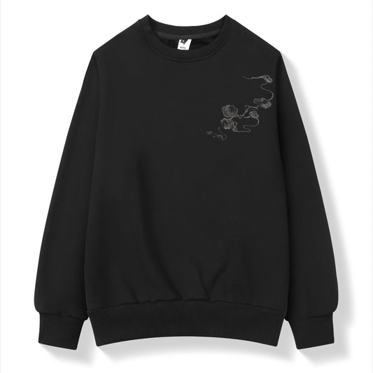 Black sweatshirt with a small design on the chest against a white background