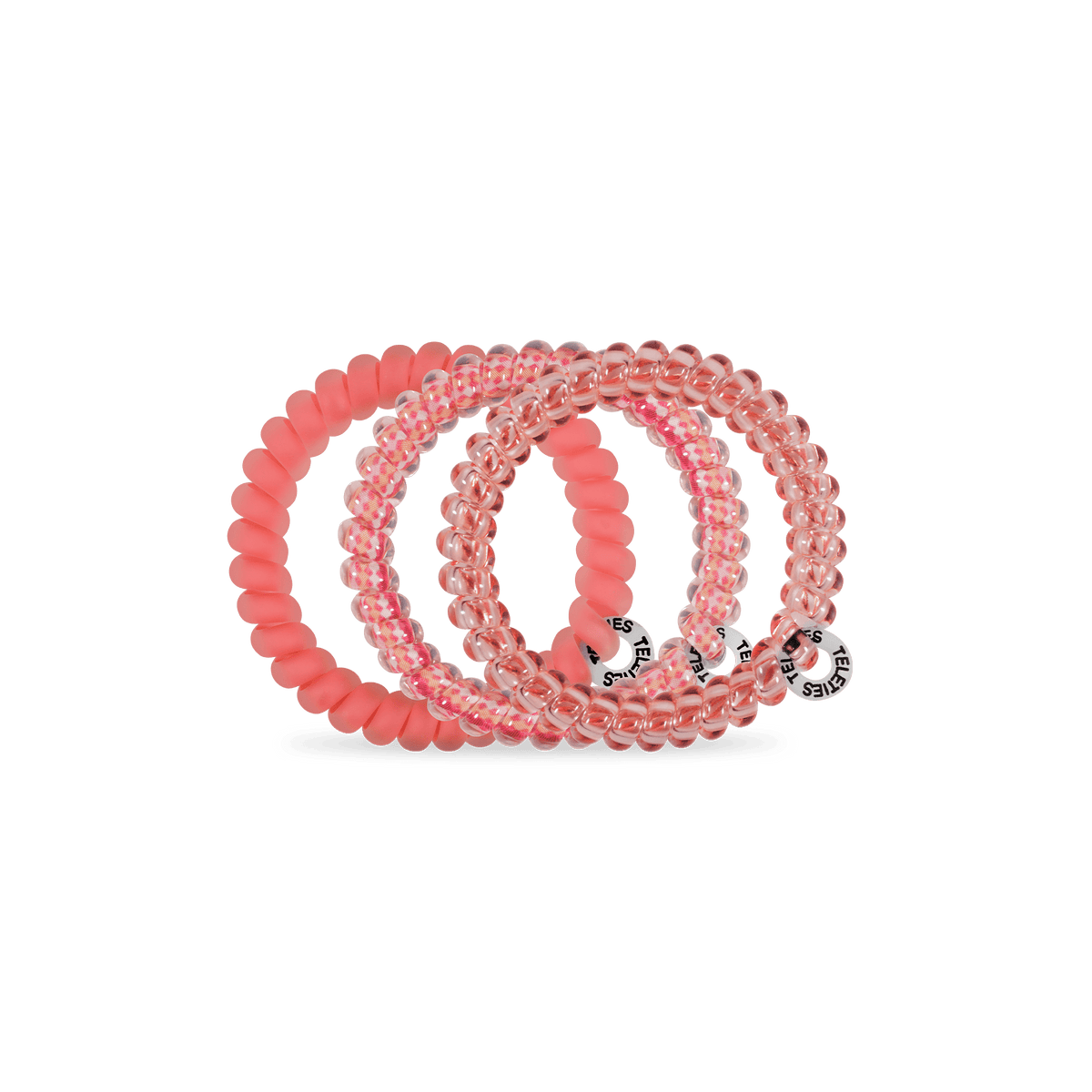 Set of pink hair ties with brand logos on a green background
