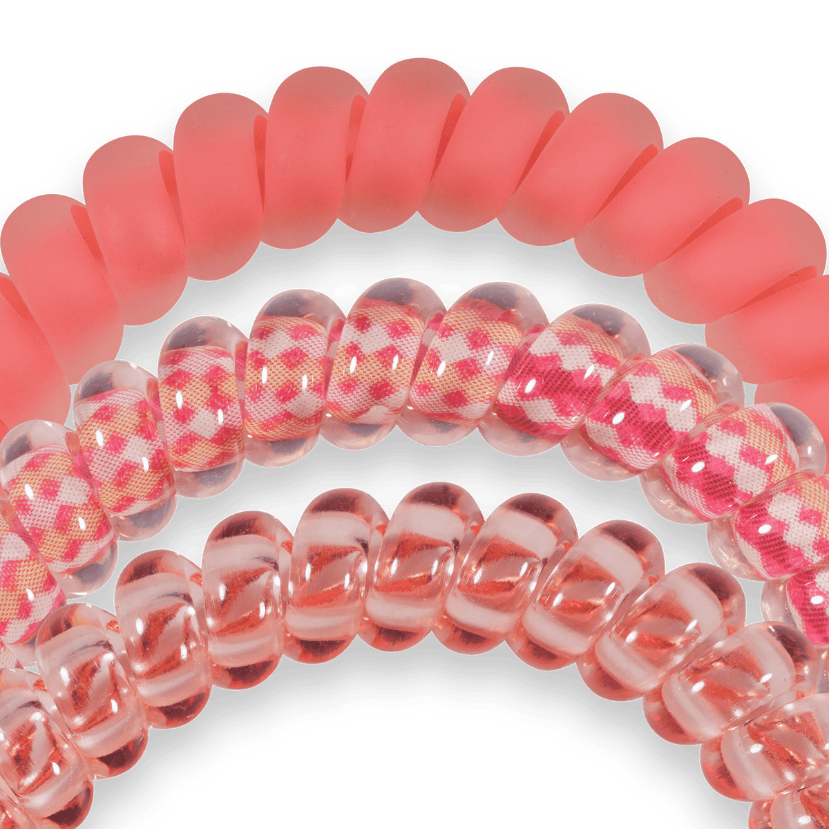 Pink and clear spiral hair ties with a checkered pattern on a green background