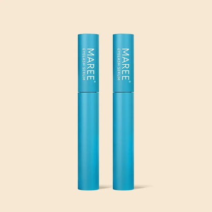 Two blue cylindrical tubes of MAREE Eyeshadow Serum standing upright on a light beige background.