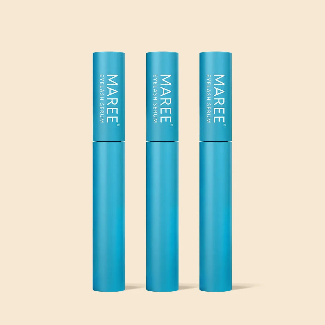 Three blue serum bottles labeled 'MAREE' on a beige background