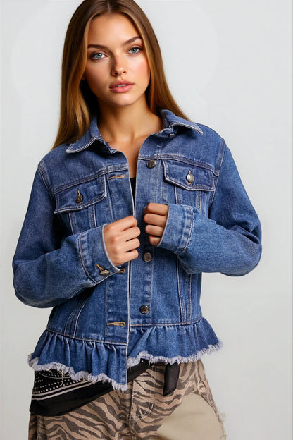 A woman wearing a cropped blue denim jacket with a ruffled hem, paired with beige zebra-print pants, against a light gray studio background.