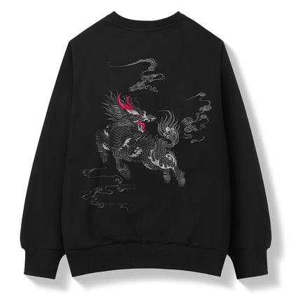 A black crewneck sweatshirt featuring a detailed graphic print of a stylized horse-drawn cloud creature in gray and white, accented with a bright red horn on the head, shown against a plain white background.