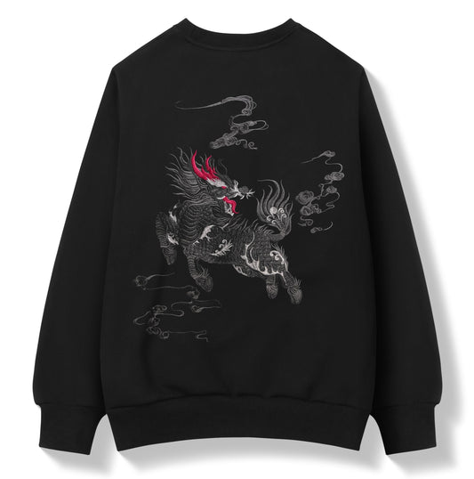 A black crewneck sweatshirt featuring a detailed graphic print of a stylized horse-drawn cloud creature in gray and white, accented with a bright red horn on the head, shown against a plain white background.