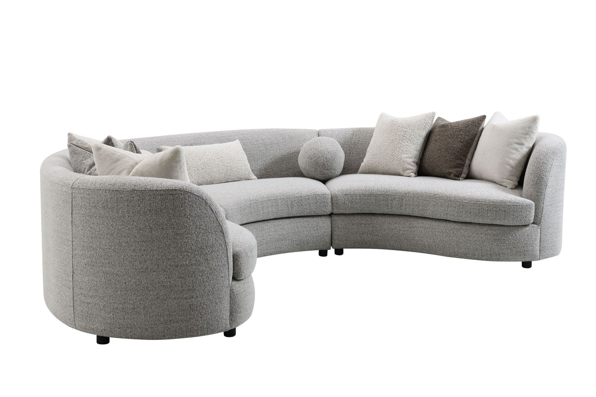 Ivria gray boucle sectional sofa with accent pillows arranged across the seat