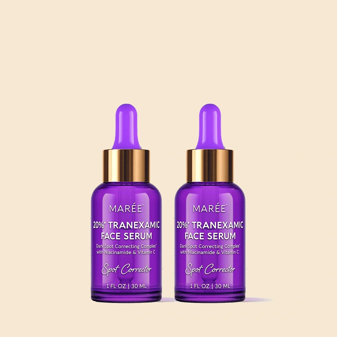 Two purple glass dropper bottles of MARÉE 20% Tranexamic Face Serum with gold caps, shown side by side on a light beige background.
