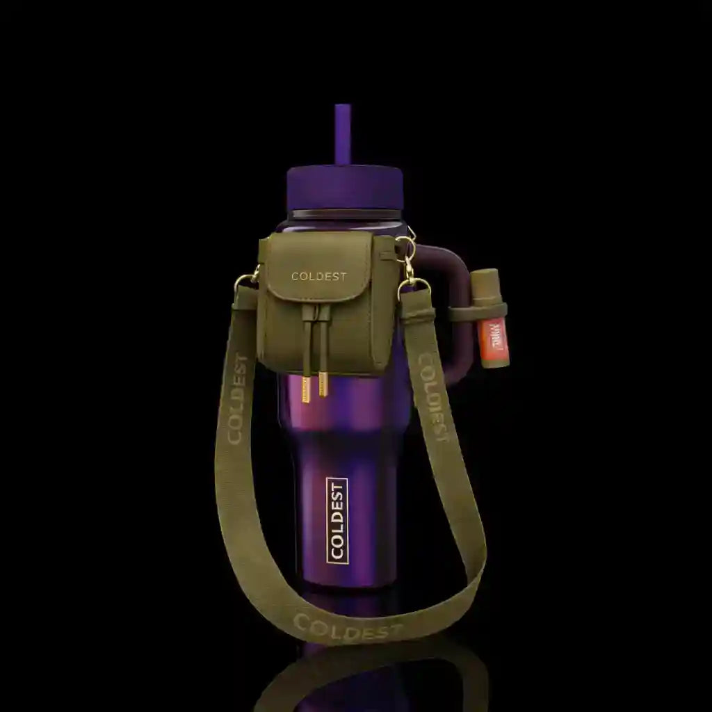 Purple water bottle with green carrying strap on a black background