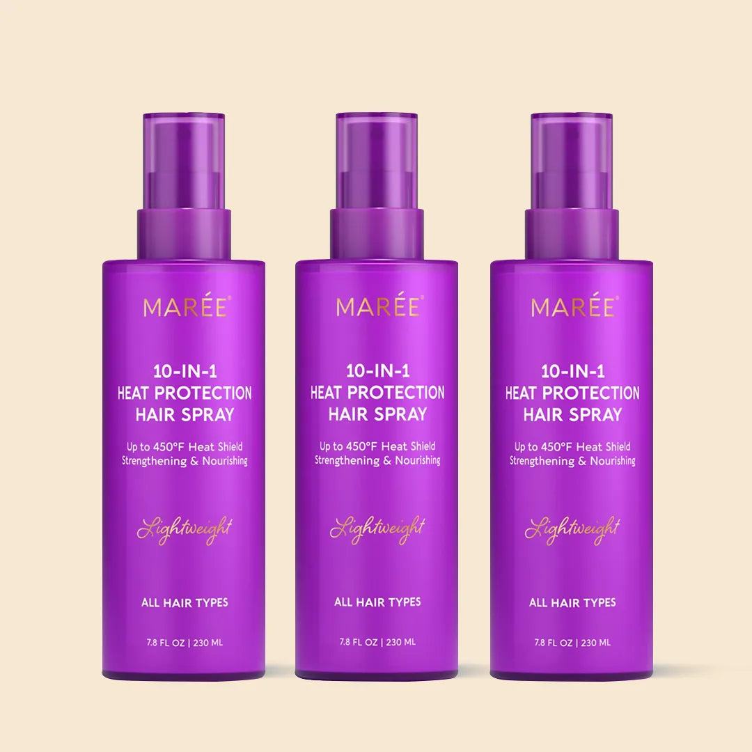 Three bottles of Maree 10-in-1 heat protection hair spray on a beige background