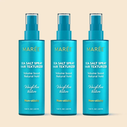 Three bottles of Mareé Sea Salt Spray Hair Texturizer on a beige background