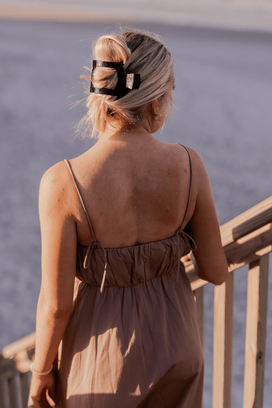 TELETIES Jet Black large flat square hair clip worn on a model, outdoor lifestyle photo