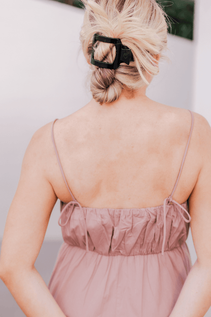 TELETIES Jet Black medium flat square hair clip worn on a model, back view