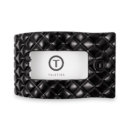 TELETIES Jet Black quilted hair clip shown open, with a branded label
