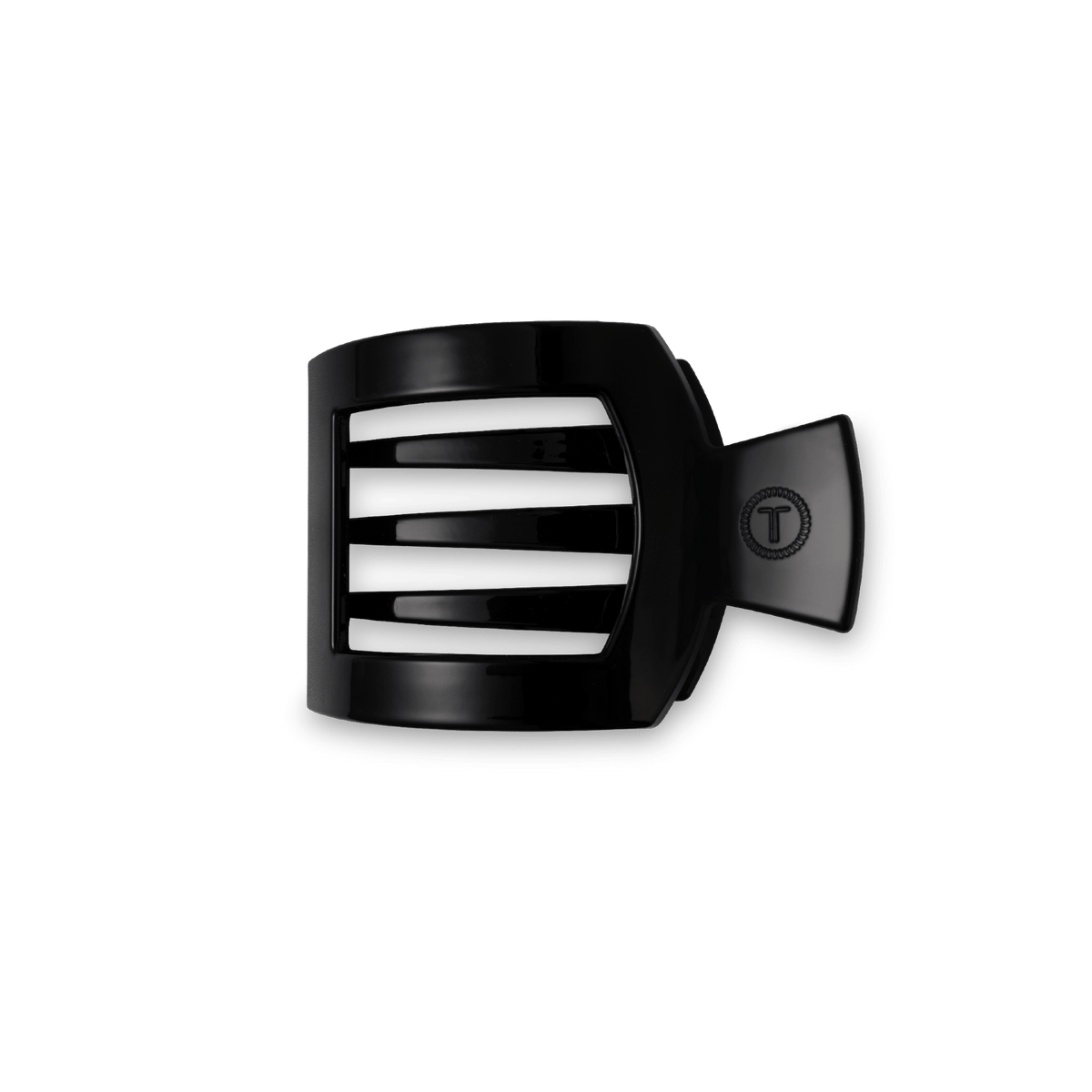 TELETIES Jet Black small flat square hair clip with an embossed T logo, on a dark green background