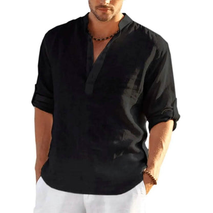 Man wearing a black shirt with rolled-up sleeves on a white background
