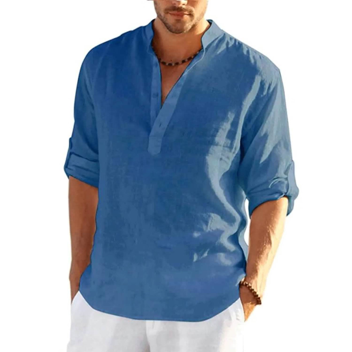 Man wearing a blue shirt with rolled-up sleeves on a white background