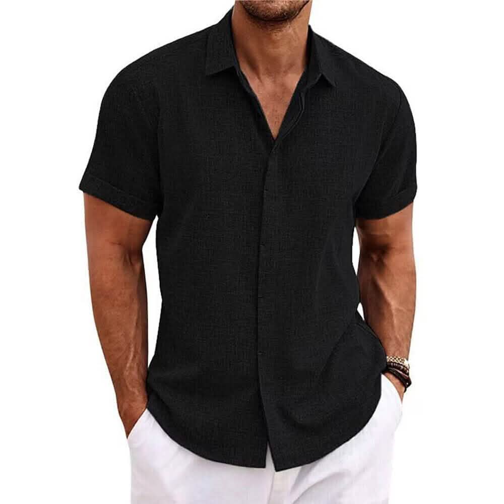 Black short-sleeve shirt worn by a person on a light purple background