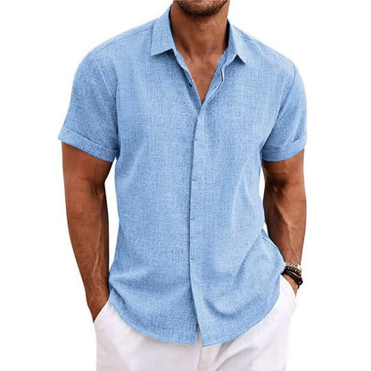 Man wearing a light blue short-sleeve shirt on a white background