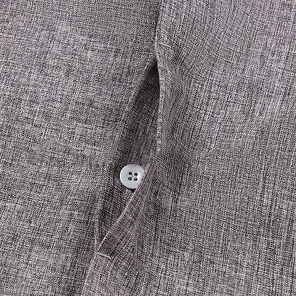 Close-up of a gray textured shirt with a button