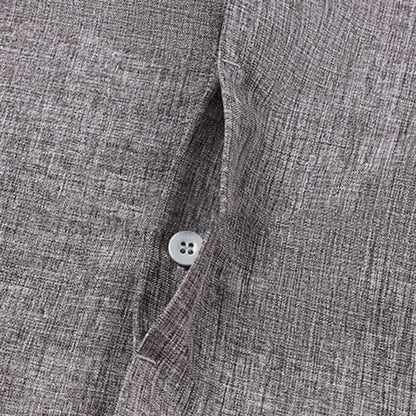 Close-up of a gray textured shirt with a button