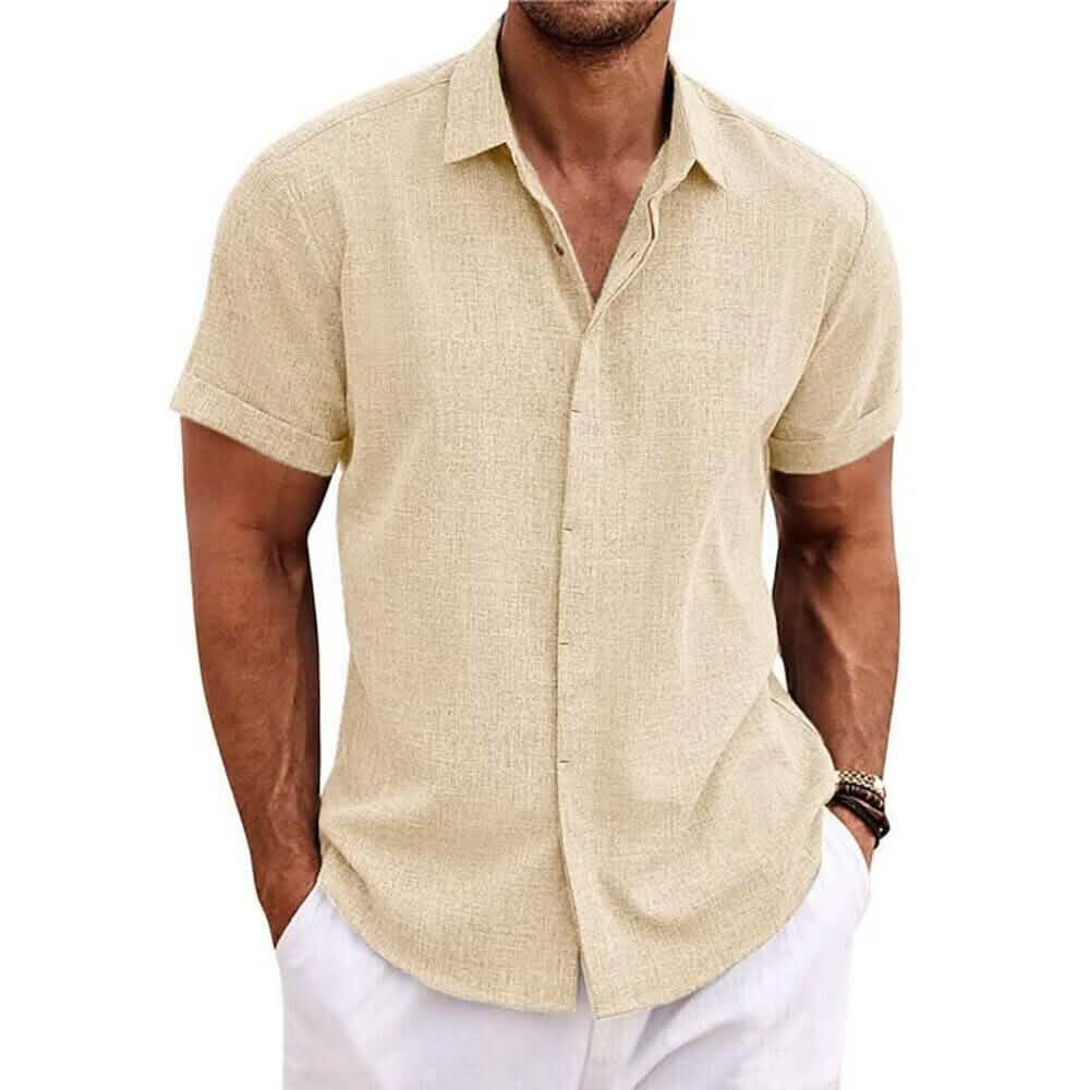 Man wearing a beige short-sleeve shirt on a white background