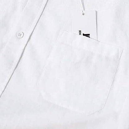 White shirt with a small black logo on the chest pocket against a white background