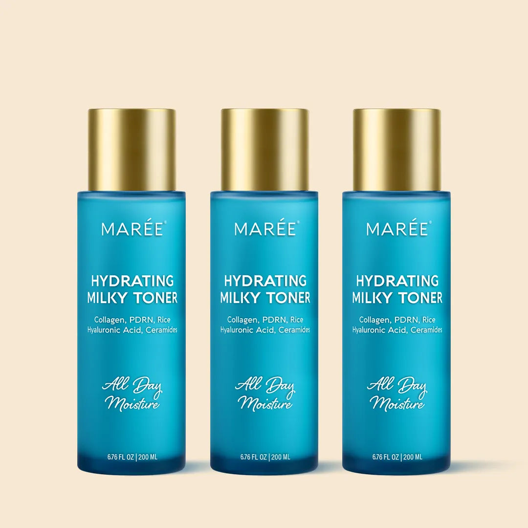 Three bottles of Marée Hydrating Milky Toner on a beige background
