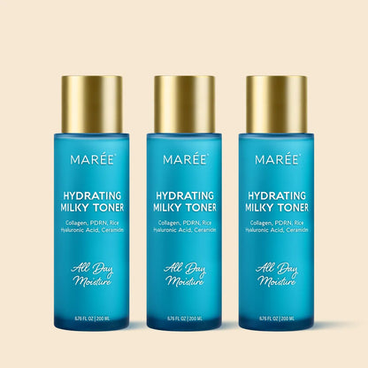 Three bottles of Marée Hydrating Milky Toner on a beige background
