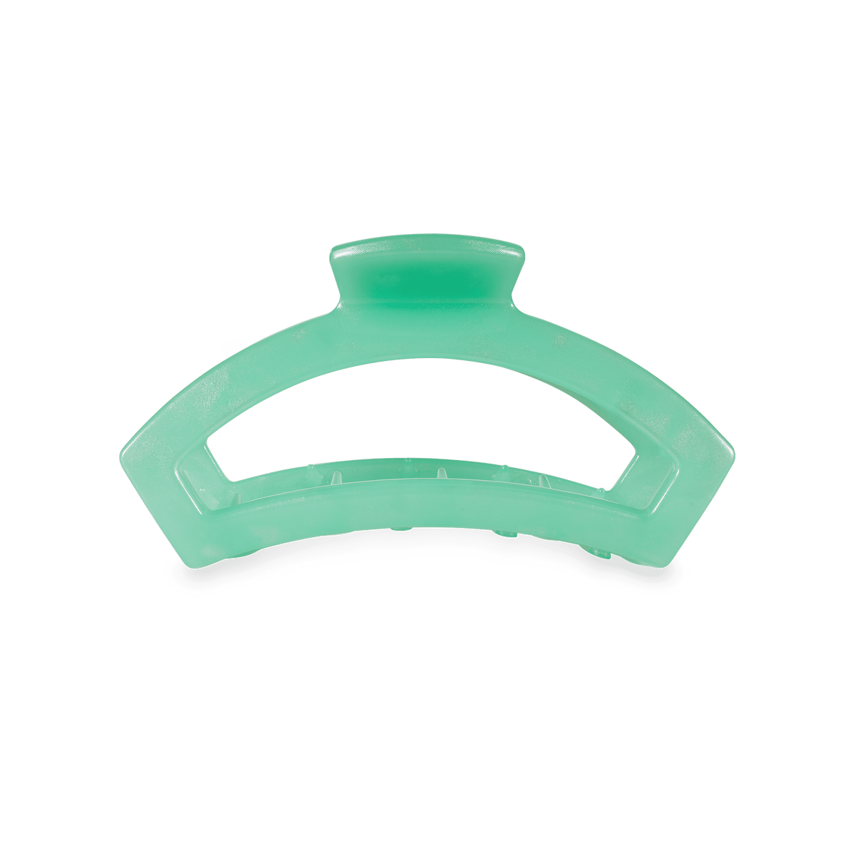 A translucent mint green hair claw clip on a solid white background.