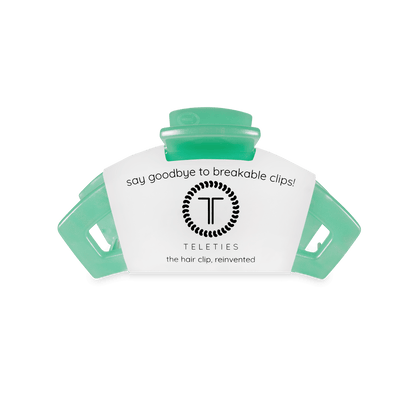 Green hair clip with Teleties branding on a white background