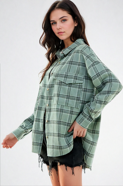 Woman wearing a green plaid shirt on a white background